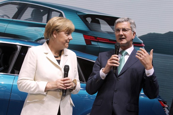 epa04934680 German Chancellor Angela Merkel (L) and Audi AG chairman of the board Rupert Stadler (R) stand in front of the new Audi E-Tron Quattro Concept car during the opening of the International M ...