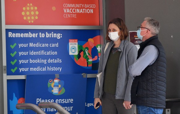 epa09330698 People are seen waiting in a queue for a vaccination for COVID-19 at the Metro South Health vaccination clinic at Capalaba in Brisbane, Australia, 08 July 2021. Queensland Premier Annastac ...