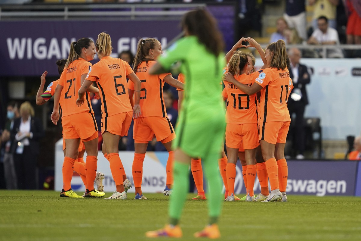 Netherlands' Danielle van de Donk, second from right, celebrates after scoring her side's third goal during the Women Euro 2022, group C, soccer match between Netherlands and Portugal, at Le ...