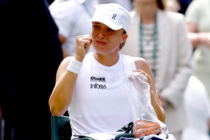 epa13075438 Iga Swiatek of Poland reacts after winning her Women's Singles first round match against Taylor Townsend of the USA at the Wimbledon Championships in London, Britain, 30 June 2026. EP ...