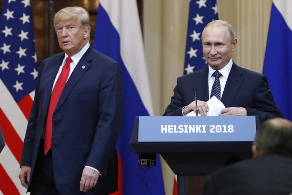 FILE - In this July 16, 2018, file photo, U.S. President Donald Trump, left, and Russian President Vladimir Putin arrive for a press conference after their meeting at the Presidential Palace in Helsin ...
