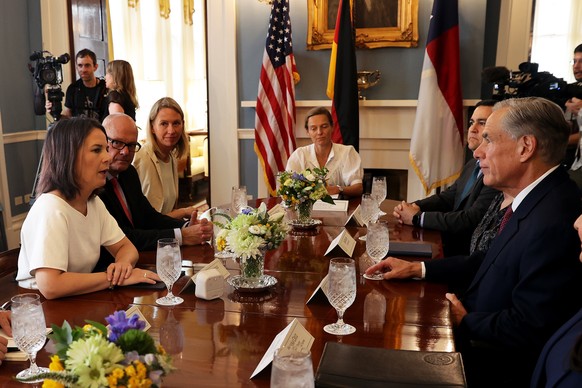epa10857488 Germany?s Federal Minister of Foreign Affairs Annalena Baerbock (L) talks with Texas Governor Greg Abbott (R) at the Governor?s Mansion in Austin Texas, USA, 12 September 2023. This is the ...