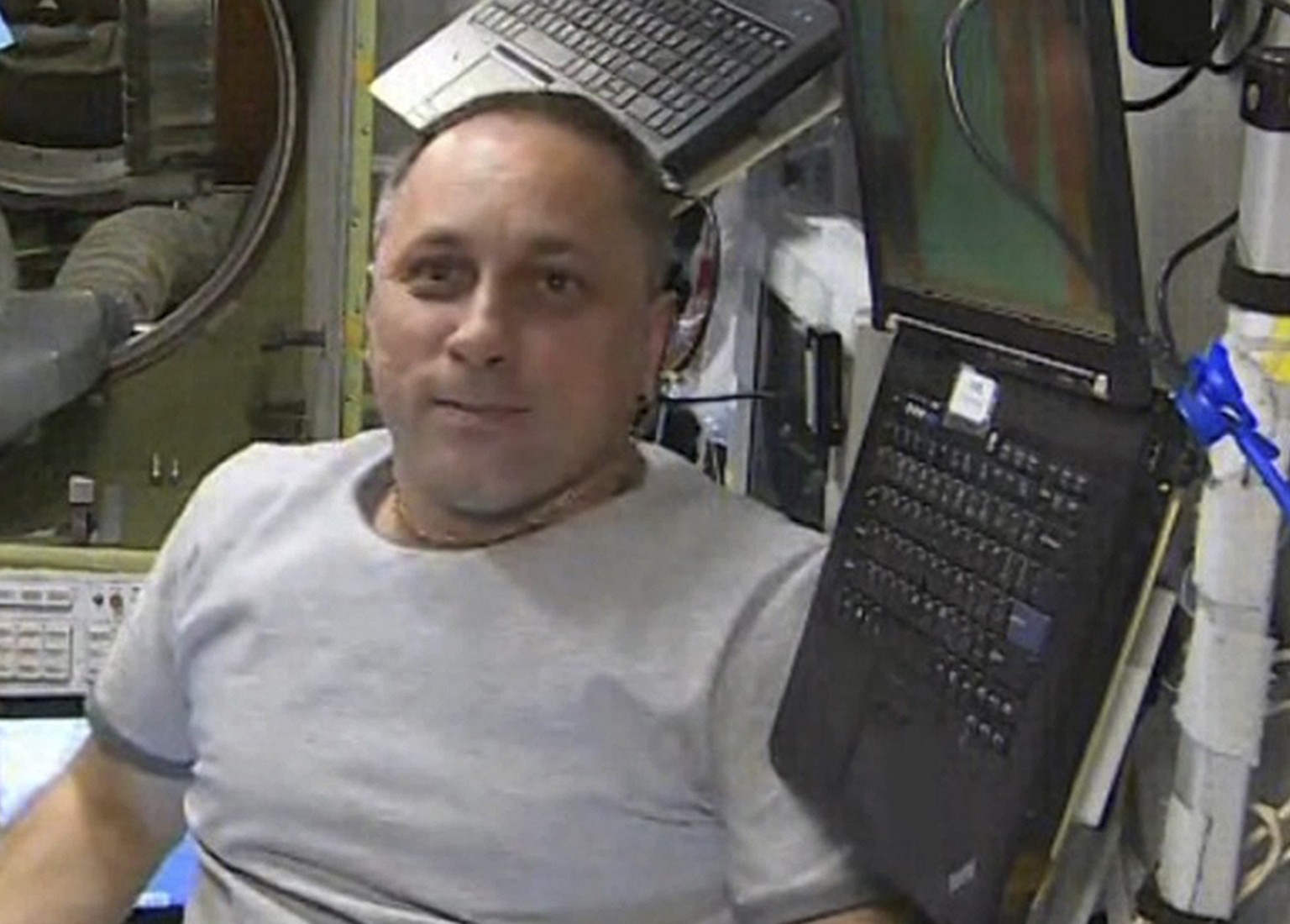 FILE - In this Oct. 7, 2021, file photo taken from video footage released by Roscosmos Space Agency, actress Yulia Peresild, left, film director Klim Shipenko, center, and cosmonaut Anton Shkaplerov s ...
