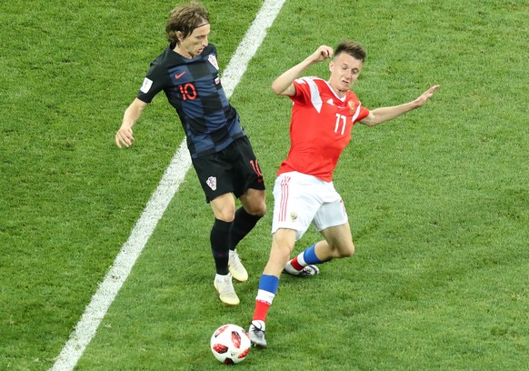 epa06872143 Luka Modric (L) of Croatia and Roman Zobnin of Russia in action during the FIFA World Cup 2018 quarter final soccer match between Russia and Croatia in Sochi, Russia, 07 July 2018.

(RES ...