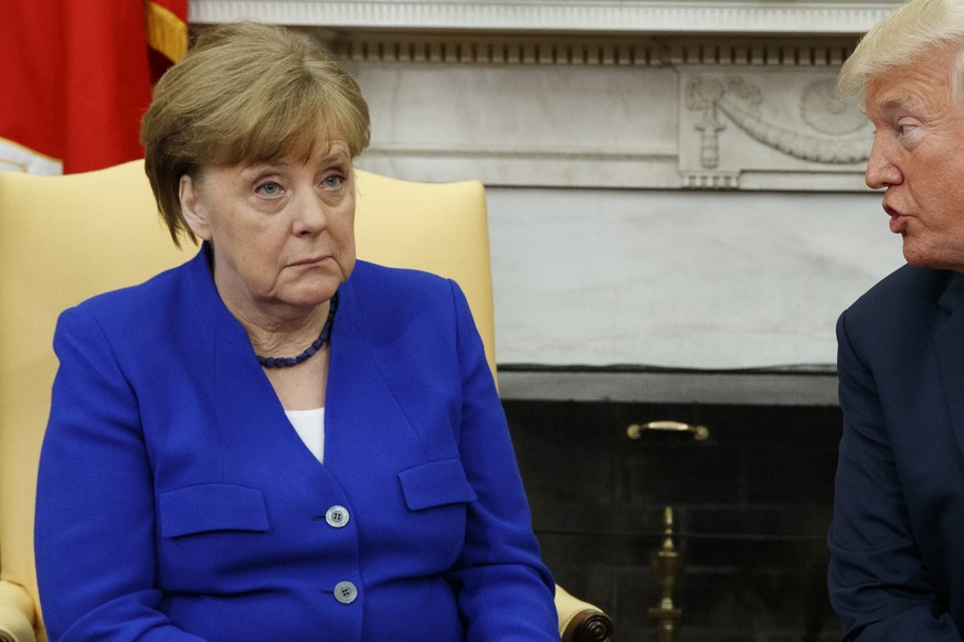 President Donald Trump meets with German Chancellor Angela Merkel in the Oval Office of the White House, Friday, April 27, 2018, in Washington. (AP Photo/Evan Vucci)