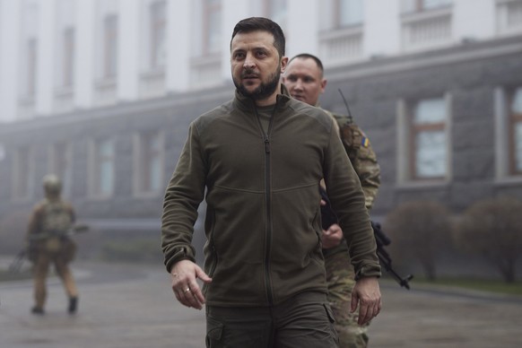 FILE - In this photo provided by the Ukrainian Presidential Press Office, Ukrainian President Volodymyr Zelenskyy, center, walks before a meeting with President of the European Parliament Roberta Mets ...