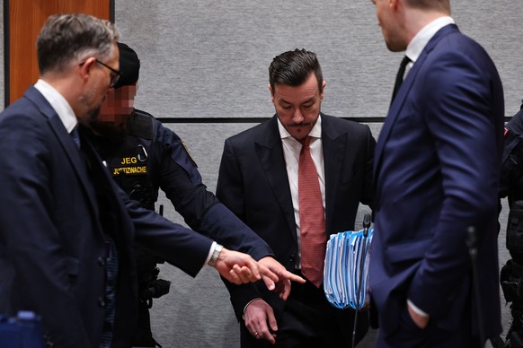 epa12452423 Rene Benko (C) and his lawyers, Hon.-Prof. Dr. Norbert Wess (L) and Dr. Thomas Pillichshammer (R), attend the main hearing in the criminal case against Benko for fraudulent bankruptcy at t ...