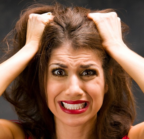 Beautiful woman dressed in red pulling her hair Copyright: xPAULxHAKIMATAx/xDesignxPicsx , 30343353 PUBLICATIONxINxGERxSUIxAUTxONLY Copyright: PAULxHAKIMATAx/xDesignxPics 30343353