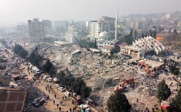 epa10458503 A picture taken with a drone shows the destruction following a powerful earthquake in the city of Kahramanmaras, Turkey, 10 February 2023. More than 21,000 people have died and thousands m ...