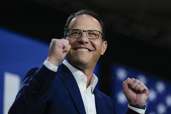 Pennsylvania Gov. Josh Shapiro gestures at a campaign event for Democratic presidential candidate Vice President Kamala Harris in Ambler, Pa., Monday, July 29, 2024. (AP Photo/Matt Rourke)