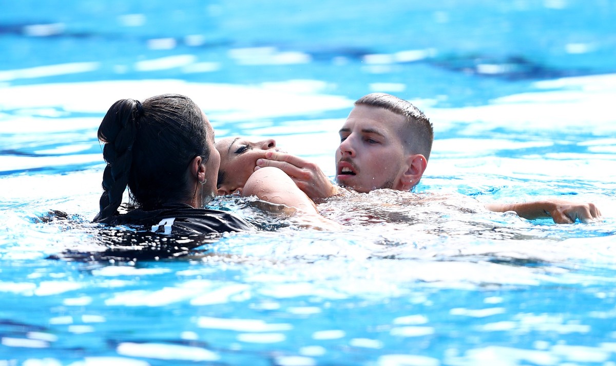 BUDAPEST, HUNGARY - JUNE 22: Anita Alvarez of Team United States is attended to by medical staff following her Women's Solo Free Final performance on day six of the Budapest 2022 FINA World Champ ...