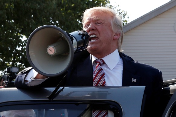 Republican presidential nominee Donald Trump speaks to supporters through a bullhorn during a campaign stop at the Canfield County Fair in Canfield, Ohio, U.S., September 5, 2016. REUTERS/Mike Segar T ...