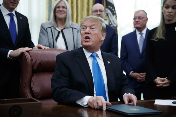 epa07381616 US President Donald J. Trump participates in a signing ceremony for Space Policy Directive 4 in the Oval Office of the White House in Washington, DC, USA, 19 February 2019. The policy dire ...