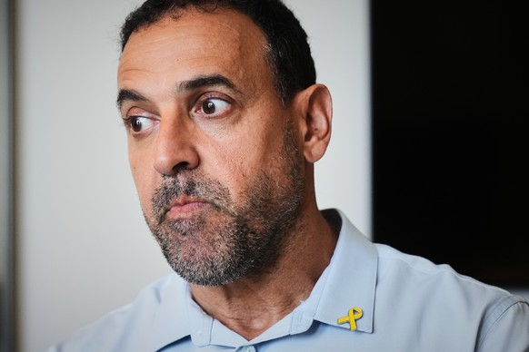 Eli Sharabi, who was abducted during the cross-border attack on Israel on Oct. 7, 2023, and held hostage by Hamas for 16 months, poses for a photo in Herzliya, Israel, Thursday, Sept. 18, 2025. (AP Ph ...