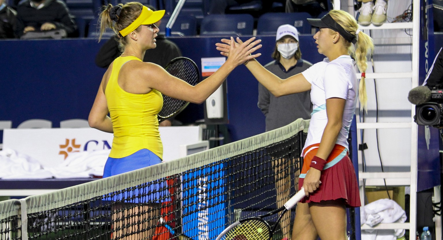 Elina Svitolina of Ukraine, left, and Anastasia Potapova of Russia shake hands after their match at the Abierto de Monterrey tennis tournament in Monterrey, Mexico, Tuesday, March 1, 2022. (AP Photo)