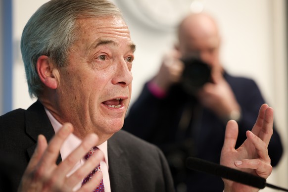 epa12651687 Reform UK leader Nigel Farage answers questions of the media during a press conference at the party's headquarters in London, Britain, 15 January 2026. Farage has confirmed Britain  ...