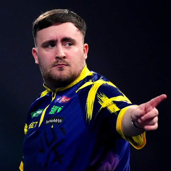 England's Luke Littler reacts during his match England's Rob Cross on day sixteen of the World Darts Championship at the Alexandra Palace, in London, Monday, Dec. 29, 2025. (John Walton/PA v ...