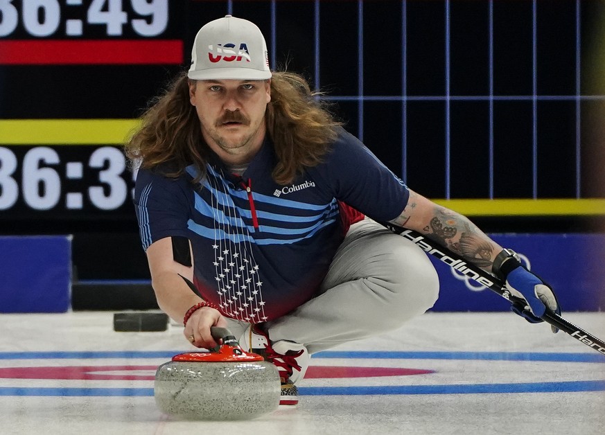 The United States&#039; Matt Hamilton throws a stone during a men&#039;s curling match against Sweden at the Beijing Winter Olympics Thursday, Feb. 10, 2022, in Beijing. (AP Photo/Brynn Anderson)