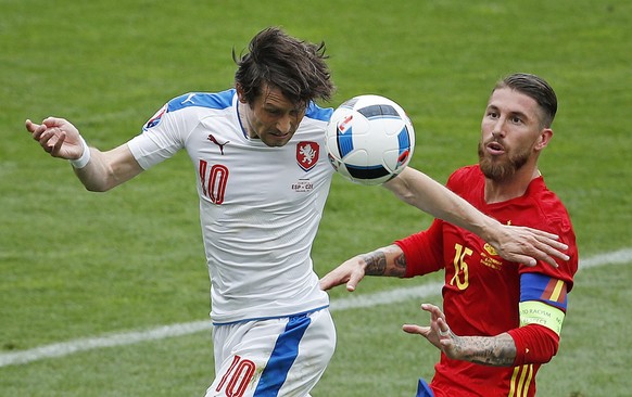 Czech Republic&#039;s Tomas Rosicky, left, heads the ball challenged by Spain&#039;s Sergio Ramos during the Euro 2016 Group D soccer match between Spain and the Czech Republic at the Stadium municipa ...