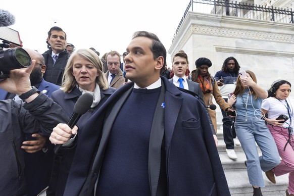 epa11005833 Republican Representative of New York George Santos (C) departs the US Capitol after the House voted to expel him from Congress in Washington, DC, USA, 01 December 2023. Santos is the sixt ...
