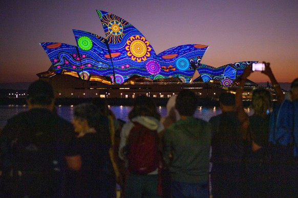 epa10429619 Kamilaroi artist Rhonda Sampson&#039;s &#039;Diyan Warrane&#039; artwork is projected onto the sails of the Sydney Opera House at dawn during Australia Day 2023 celebrations in Sydney, Aus ...