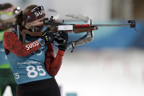 Switzerland's Irene Cadurisch aims her rifle during a biathlon training session, at the 2018 Winter Olympics in Pyeongchang, South Korea, Monday, Feb. 19, 2018. (AP Photo/Andrew Medichini)