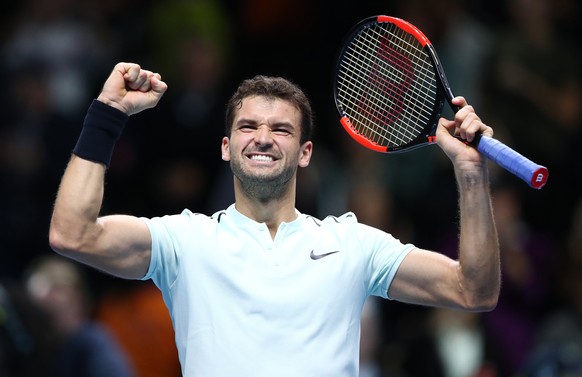 epa06331488 Grigor Dimitrov of Bulgaria celebrates winning his round robin match against David Goffin of Belgium at the ATP World Tour Finals tennis tournament in London, Britain, 15 November 2017. EP ...