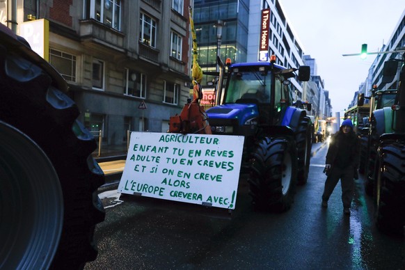 Tractors arrive in the European Quarter during a protest of farmers outside a meeting of EU agriculture ministers in Brussels, Monday, Feb. 26, 2024. European Union agriculture ministers meet in Bruss ...