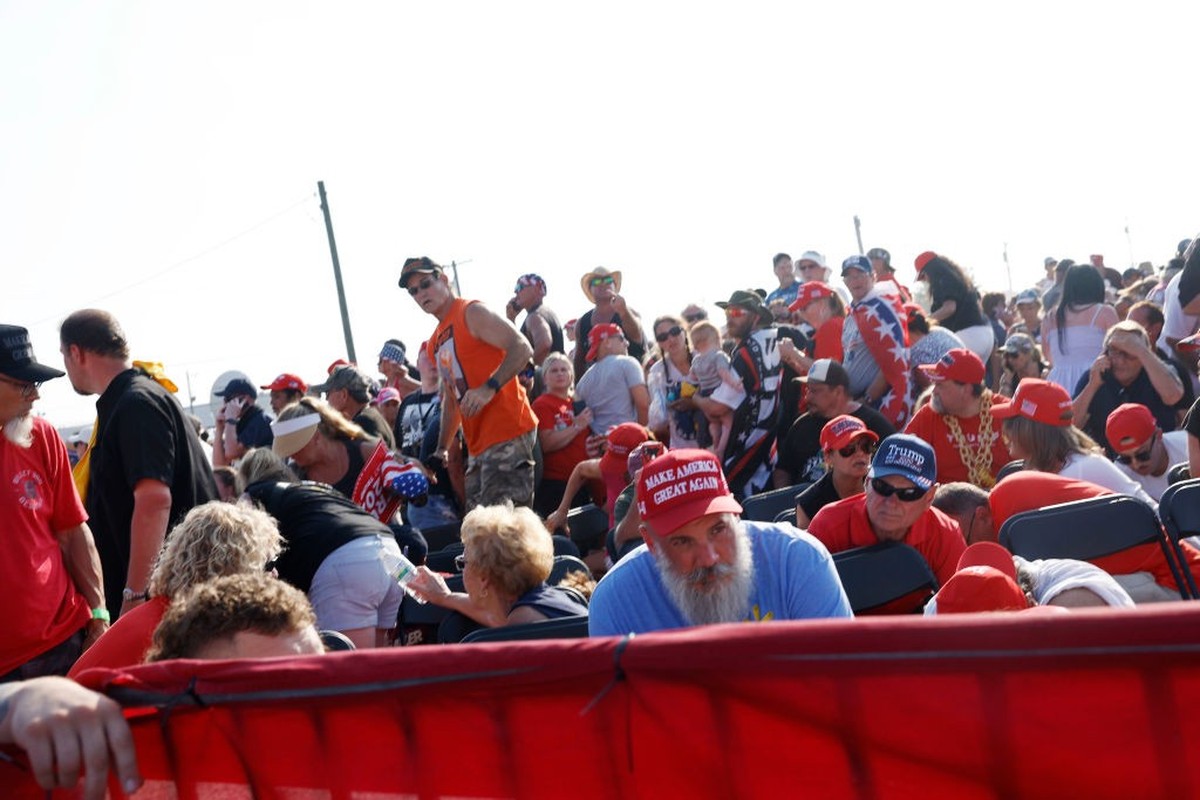 BUTLER, PENNSYLVANIA - JULY 13: The crowd reacts after shots were fired at republican presidential candidate former President Donald Trump's rally on July 13, 2024 in Butler, Pennsylvania. Butler ...