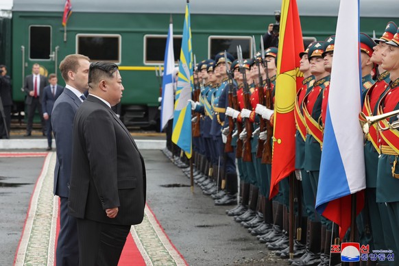 epa10867400 A photo released by the official North Korean Central News Agency (KCNA) shows North Korean leader Kim Jong Un (2-L) reviewing a guard of honor during a send-off ceremony at the end of his ...