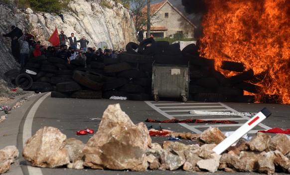 epa09448734 A barricade is set on fire during a protest against the enthronement of the Serbian Orthodox bishop in Cetinje, Montenegro, 05 September 2021. The enthronement of the new bishop of the Ser ...