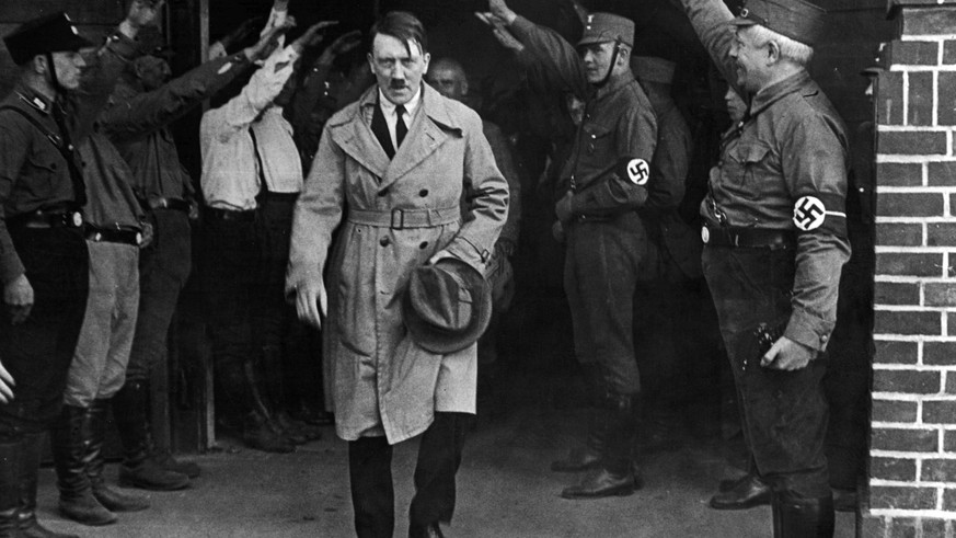 FILE - In this Dec. 5, 1931 file photo, Adolf Hitler, leader of the National Socialists, is saluted as he leaves the party&#039;s Munich headquarters. The book, &quot;Human Rights After Hitler&quot; b ...