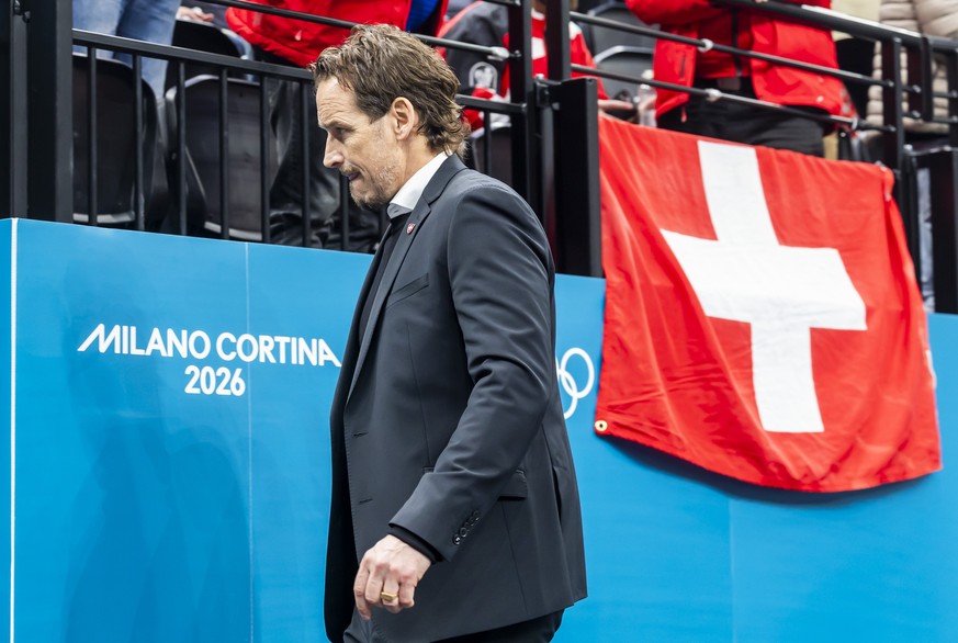Patrick Fischer, head coach of Switzerland national ice hockey team, looks disappointed as they leave his bench after the second period, during the men's group A preliminary round game between Ca ...