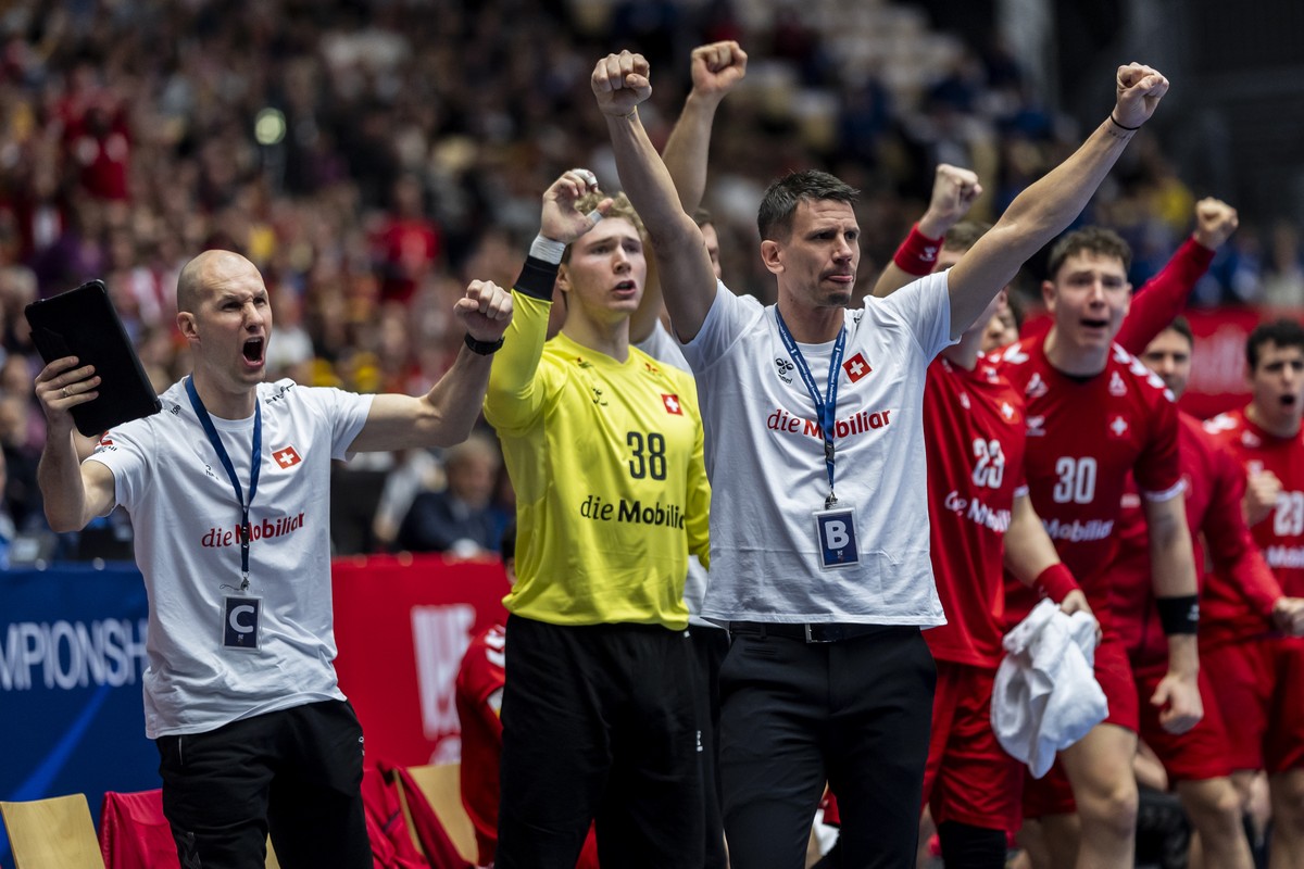 The Swiss bench with Switzerland's Head Coach Andy Schmid, center, during the Men's Handball World Championships preliminary round group A match between Switzerland and Germany at Jyske Bank ...