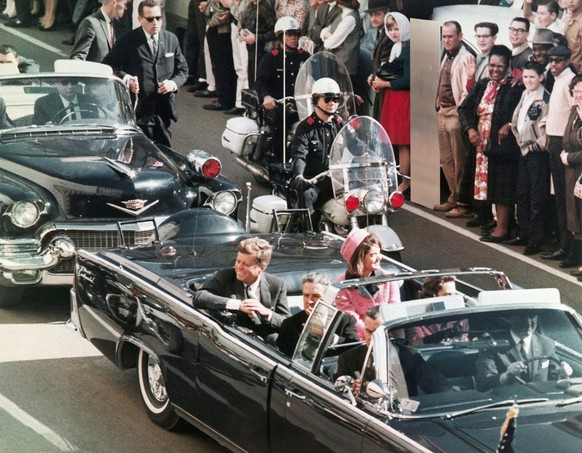 FILE - In this Nov. 22, 1963 file photo, President John F. Kennedy's motorcade travels through Dallas. (AP Photo/PRNewsFoto/Newseum, File) THIS CONTENT IS PROVIDED BY PRNewsfoto and is for EDITORIAL U ...