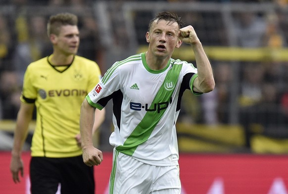 Wolfsburg&#039;s Ivica Olic makes a fist after scoring the opening goal during the German Bundesliga soccer match between Borussia Dortmund and VfL Wolfsburg in Dortmund, Germany, Saturday, April 5, 2 ...