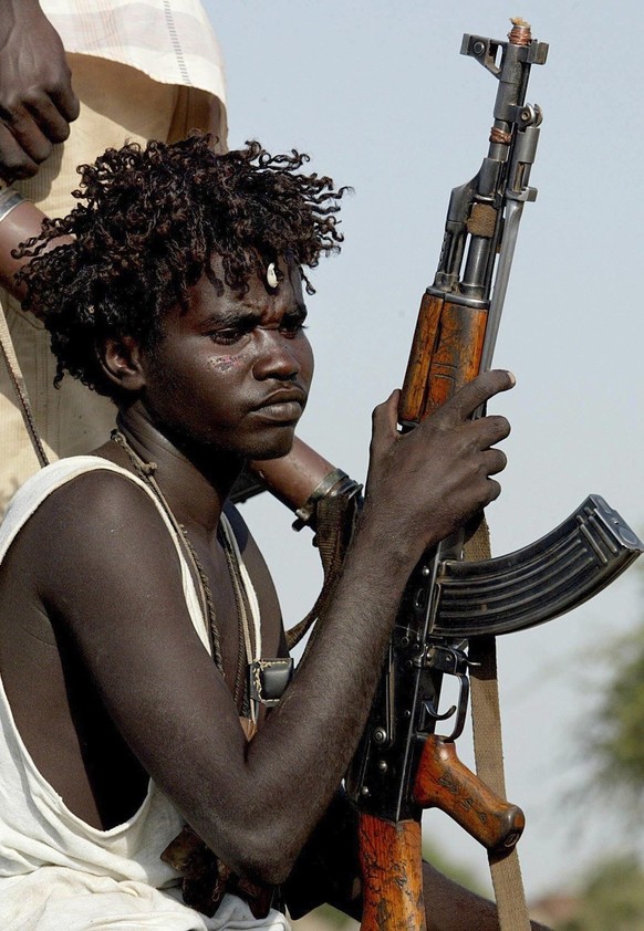 The photo taken on October 23, 2004 shows a Sudanese SLA (Sudan Liberation Army) soldier in the village of Muhajiriyah in SLA-controlled South Darfur, Sudan.  At the UN Security Council meeting in Nairobi,...