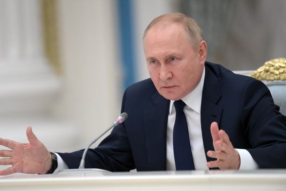 epa10057679 Russian President Vladimir Putin attends a meeting with leaders of the Russian State Duma, the lower house of parliament, and heads of parliamentary factions at the Kremlin in Moscow, Russ ...