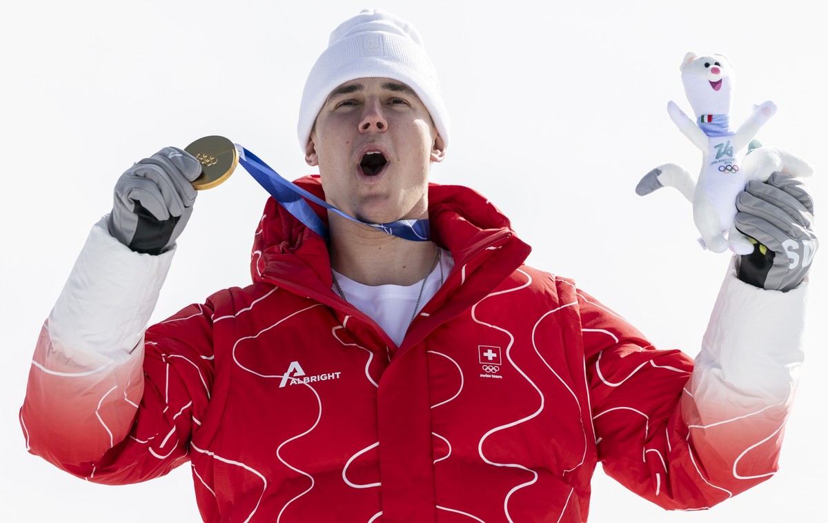 Gold medalist Switzerland's Franjo von Allmen on the podium during the medal ceremony after the men's alpine skiing downhill race at the 2026 Olympic Winter Games at the Stelvio Ski centre i ...