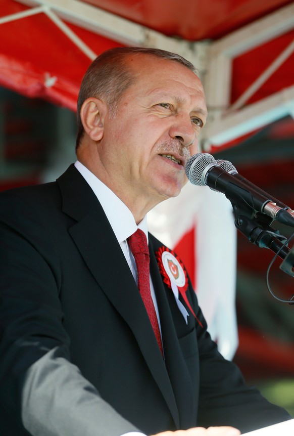 epa06986148 A handout photo made available by Turkish President Press office shows Turkish President Recep Tayyip Erdogan speaking during a graduation ceremony of Turkish Land Forces Command (NCO) voc ...