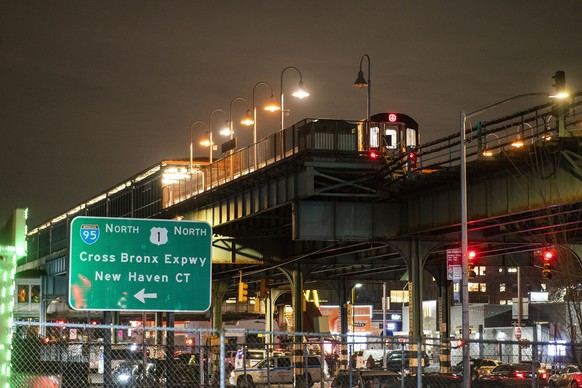 A subway train remains in investigation by police officers after a shooting at the Mount Eden Avenue subway station, Monday, Feb. 12, 2024, in the Bronx borough of New York. (AP Photo/Eduardo Munoz Al ...