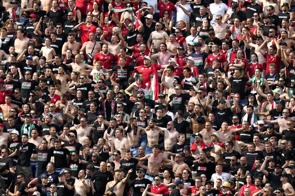 epa09285630 Fans of Hungary attend the UEFA EURO 2020 group F preliminary round soccer match between Hungary and France in Budapest, Hungary, 19 June 2021. EPA/Darko Bandic / POOL (RESTRICTIONS: For e ...