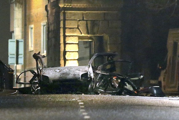 This photo taken on Saturday, Jan. 19, 2019 shows the scene of a suspected car bomb on Bishop Street in Londonderry, Northern Ireland. Northern Ireland politicians are condemning a car bombing outside ...