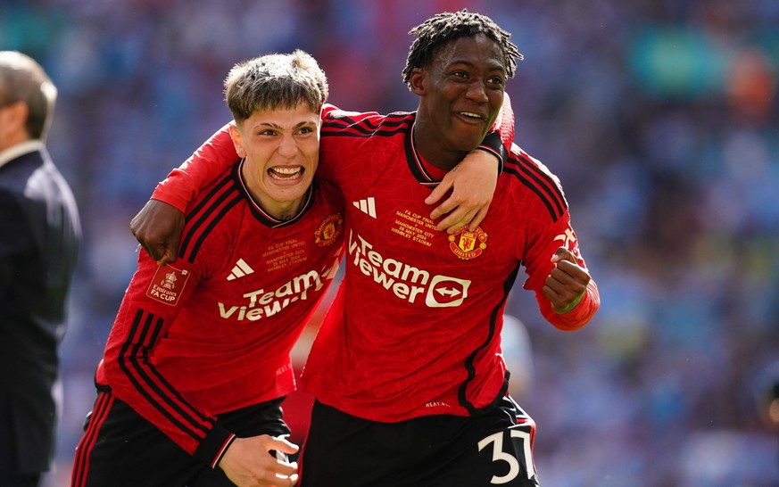 Manchester City v Manchester United, ManU - Emirates FA Cup - Final - Wembley Stadium Manchester United s Alejandro Garnacho left and Kobbie Mainoo celebrate after winning the Emirates FA Cup final at ...