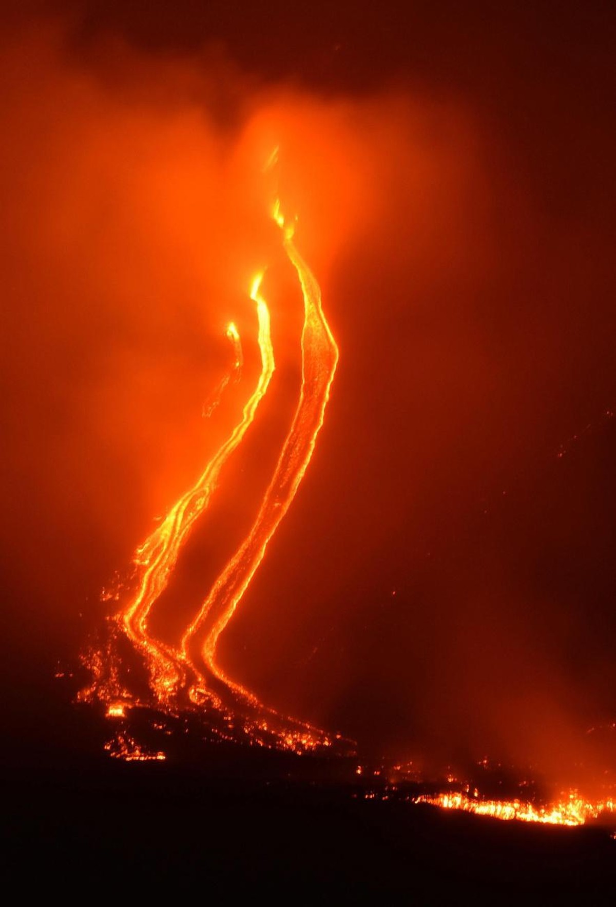 epa07248154 A view of lava flowing downhill after an eruption of the the Etna volcano, near Catania, Sicily island, southern Italy, 24 December 2018 (issued 25 December 2018). The intense seismic acti ...