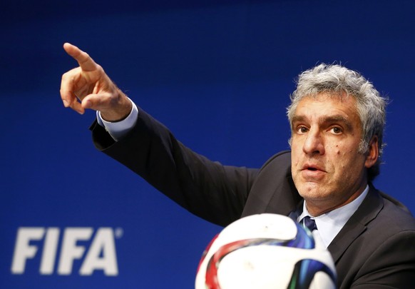 File photo of Walter De Gregorio, FIFA Director of Communications and Public Affairs gestures during a news conference at FIFA headquarters in Zurich, Switzerland, May 27, 2015. The United States has infuriated some of its closest allies in recent years by fining their banks and spying on their citizens. But its latest extra-territorial salvo, a crackdown on graft at soccer's global governing body, is winning wide applause abroad. Following news May 27, 2015 that the U.S. Justice Department, supported by FBI investigators, was charging nine current and former FIFA officials with illegal payments, kickbacks and bribes, the Twittersphere was flooded with rare cheers of approval for the &quot;world's policeman&quot;.   REUTERS/Ruben Sprich/Files 