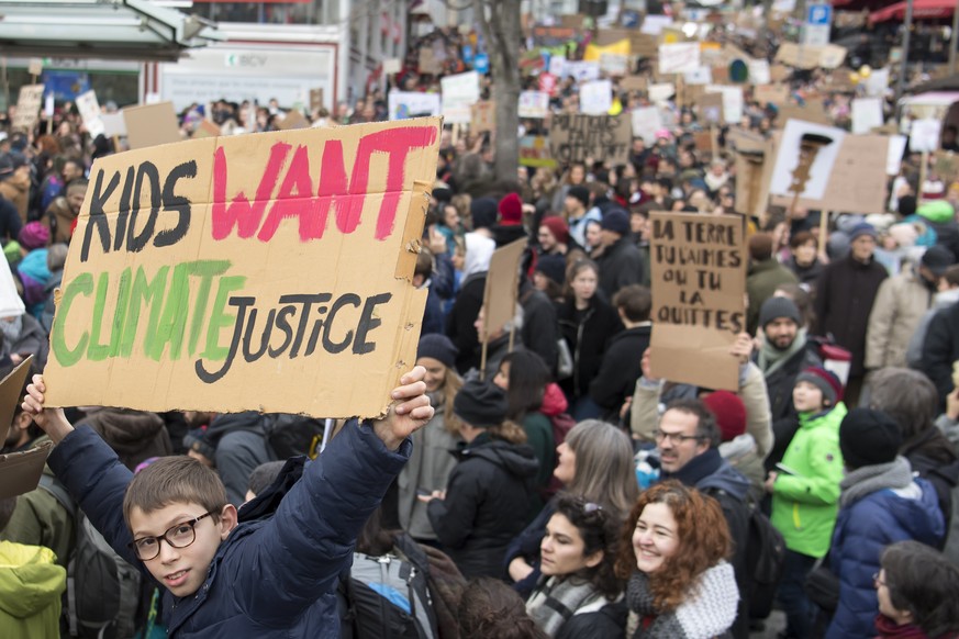 People demonstrate during a &quot;Climate strike&quot; demonstration to protest a lack of climate awareness in Lausanne, Switzerland, Saturday, February 2, 2019. Over 10&#039;000 people according to t ...