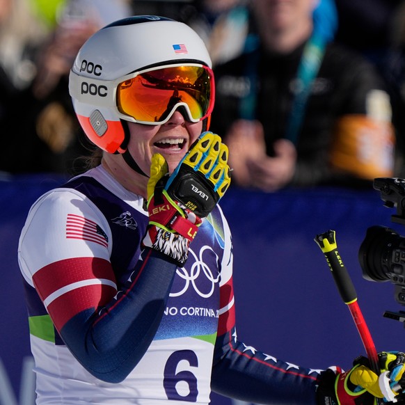 United States' Breezy Johnson celebrates at the finish area of an alpine ski women's downhill race, at the 2026 Winter Olympics, in Cortina d'Ampezzo, Italy, Sunday, Feb. 8, 2026. (AP P ...
