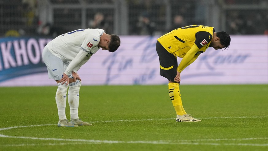 Players react after the final whistle of the German Bundesliga soccer match between Borussia Dortmund and TSG Hoffenheim at the Signal-Iduna Park in Dortmund, Germany, Sunday, Dec. 15 2024. (AP Photo/ ...