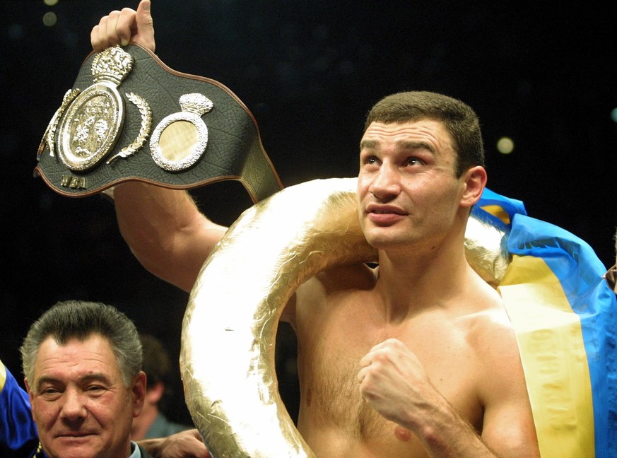 FILE - In this Jan. 28, 2001, file photo, Vitali Klitschko, of Ukraine, shows the world championship belt. after he knocked out Orlin Norris, of the United States, in the first round of a WBO heavywei ...